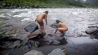 Two indian mature womens  bathing in river naked