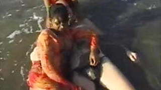 2 Indian girls with white guy in beach have fun blowjob..