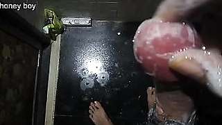 Honey boy washing his dick with shampoo.
